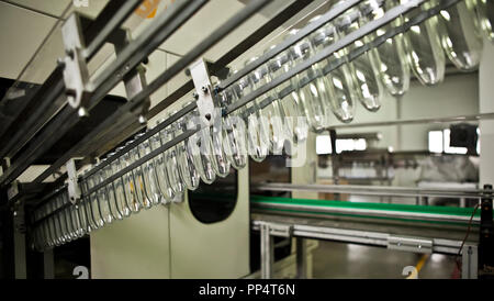 Production of the bottles plastic The Technological line on production of the plastic bottles. Stock Photo