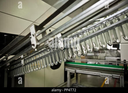 Production of the bottles plastic The Technological line on production of the plastic bottles. Stock Photo