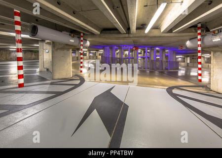 Empty circular parking garage ramp in a shopping mall Stock Photo