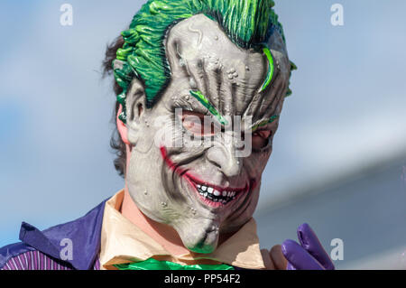 Glasgow, Scotland, UK. 23rd September, 2018. A cosplayer dressed as the fictional supervillain The Joker from the comic books published by DC Comics, arriving on day two of the MCM Scotland Comic Con held at the SEC Centre. Credit: Skully/Alamy Live News Stock Photo