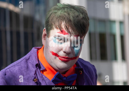 Glasgow, Scotland, UK. 23rd September, 2018. A cosplayer dressed as the fictional supervillain The Joker from the comic books published by DC Comics, arriving on day two of the MCM Scotland Comic Con held at the SEC Centre. Credit: Skully/Alamy Live News Stock Photo