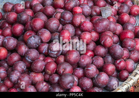 Background with plums fruit in the southeast asia market, picture use for design, advertising, marketing, business and printing Stock Photo