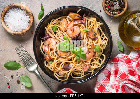 Pasta spaghetti with seafood and tomato sauce. Stock Photo