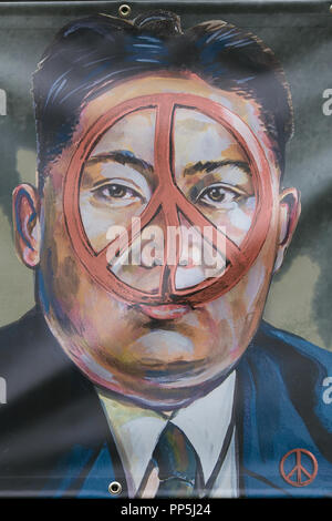 Kim Jong-un with a peace sign on his face Stock Photo