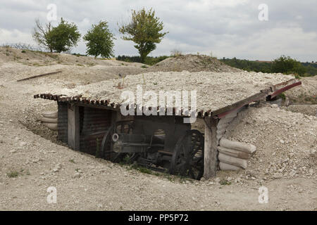 German field cannon used during the First World War in the Main de Massiges in Marne region in north-eastern France. The Main de Massiges was one of the major sites of the First World War from 1914 to 1918. The field cannon (model 7.7 cm Feldkanone 96 neuer Art) was used by German troops when the area was conquered by the 23rd Colonial Infantry Regiment of the French Army on 25 September 1915. The cannon and the shelter were restored during the restoration works in the area realized by the Main de Massiges Association since 2009. Stock Photo