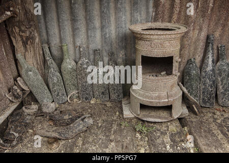 Kitchen facilities in the trench used during the First World War in the Main de Massiges in Marne region in north-eastern France. The Main de Massiges was one of the major sites of the First World War from 1914 to 1918. The trench of German origin was conquered by the 23rd Colonial Infantry Regiment of the French Army on 25 September 1915 and was the first line of French defence from September to October 1915. The kitchen facilities were restored using the original field stove and wine bottles found in the area by the Main de Massiges Association. Stock Photo