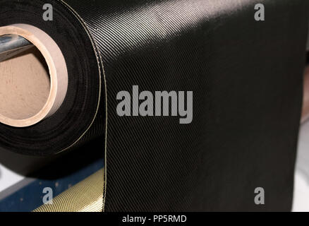 Carbon fiber rolled weave composite material industry Stock Photo