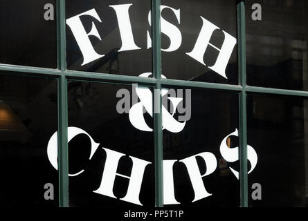 Colorful cartoon sign in the window of Brit & Chips in Montreal, QC, Canada Stock Photo