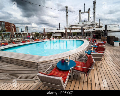 Cruise Ship Pool - the swimming pool on the deck of the SS Rotterdam, now permanently moored in Rotterdam city harbour Stock Photo
