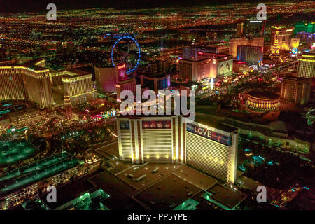 Las Vegas, Nevada, United States - August 18, 2018: aerial view of Las Vegas Strip by night. Scenic flight: High Roller Ferris Whell, The Mirage, Flamingo, Caesars Palace, The Paris, Casino Bellagio. Stock Photo