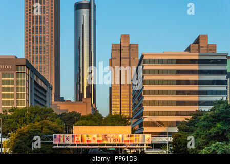 The rising sun illuminates downtown Atlanta, Georgia as early morning commuters enter the city on Andrew Young International Boulevard. (USA) Stock Photo