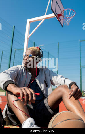 Contemporary African Man on Basketball Court Stock Photo