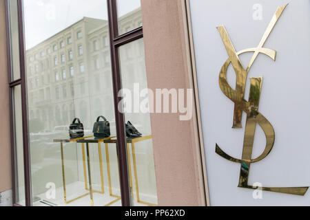 A logo sign outside of a Yves Saint Laurent retail store in Munich, Germany, on September 2, 2018. Stock Photo