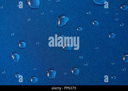 Rain drops on blue metal surface. Abstract texture Stock Photo