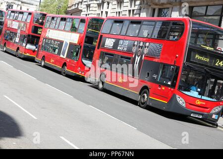 LONDON, UK - MAY 13, 2013: People ride London Buses in London. As of 2012, LB serves 19,000 bus stops with a fleet of 8000 buses. On a weekday 6 milli Stock Photo