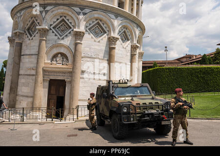 Armoured vehicle and soldiers with automatic rifles to protect public in case of terrorist atttck,  Pisa, Tuscany, Italy Stock Photo