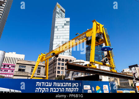 Yellow overhead crane at subway construction site in Tel Aviv, Israel Stock Photo