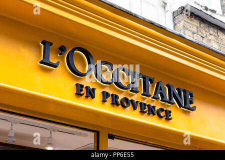 Sign brand logo of L'Occitane en Provence, cosmetics and beauty brand, shop in St Christopher's Place, Oxford Street, London, UK Stock Photo