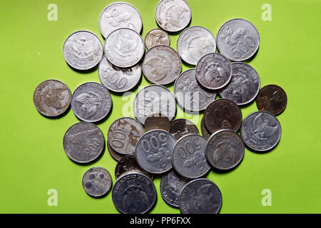 Plenty of Collectible Coins in Closeup Photography. Indonesia, Malaysia, Brunei coins. Stock Photo