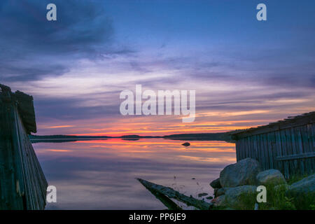 Beautiful purple sunset on a small lake in Karelia, Russia. Stock Photo
