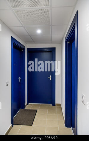 Front door of several flats in an apartment building Stock Photo