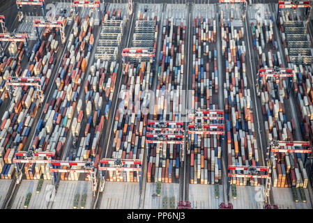 view of cargo shipping containers stacked on docks.