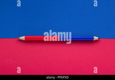Close-up of a red blue pencil on a background, concept of education Stock Photo