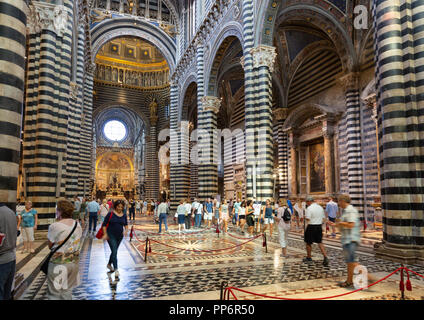 Tourists in the interior of Siena Cathedral ( Duomo Siena ), Siena, Tuscany Italy Europe Stock Photo