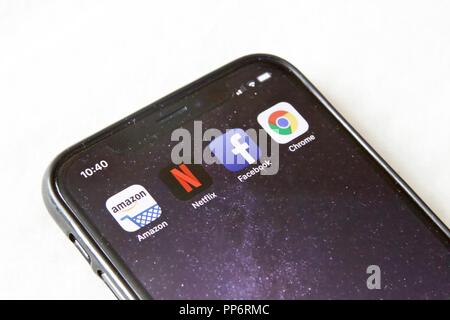 FAANG concept (Facebook,Apple,Amazon,Netflix,Google). Amazon,Chrome, Facebook, Netflix apps on an iPhone X Stock Photo