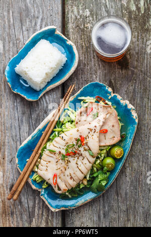 Squid salad with beer, flat lay, top view Stock Photo
