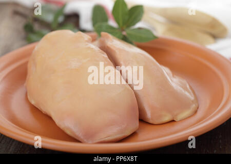 Raw Foie gras on the rustic plate Stock Photo