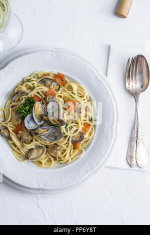 Seafood pasta with clams Spaghetti alle Vongole on white background Stock Photo