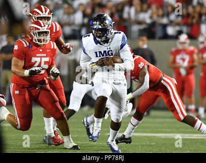 Santa Ana, CA. 21st Sep, 2018. IMG Academy Ascenders quarterback David Baldwin #5 runs in the first half of the Prep Football game Mater Dei High School vs. IMG Academy Ascenders, in Santa Ana, California.Photo © Louis Lopez /Modern Exposure/Cal Sport Media/Alamy Live News Stock Photo