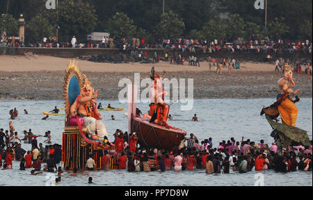 Mumbai, India. 23rd Sep, 2018. Indian devotees carry the idol of the elephant-headed Hindu god Lord Ganesha for immersion on the last day of Ganesh festival as part of a ritual, in Mumbai, India, Sept. 23, 2018. Credit: Stringer/Xinhua/Alamy Live News Stock Photo