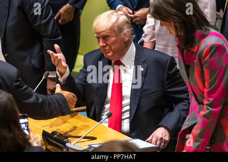 New York, USA, 24 September 2018. US President Donald Trump gestures next to Ambassador Nikki Haley  after addressing a high-level event on countering narcotics convened by the United States delegation at their headquarters in New York. Trump presented his Global Call to Action on the World Drug Problem. Photo by Enrique Shore Credit: Enrique Shore/Alamy Live News Stock Photo