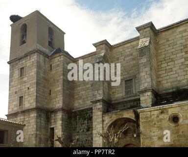 Spain. Community of Madrid. Cadalso de los Vidrios. Church of the Assumption, built in the 16th century with the stones of the old wall. Gothic style with herrerian added's. Stock Photo