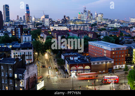 London England,UK,South Bank,Lambeth North Station,city skyline,night dusk,buildings,skyscrapers,rooftops,car vehicle light streaks,overhead view,red Stock Photo
