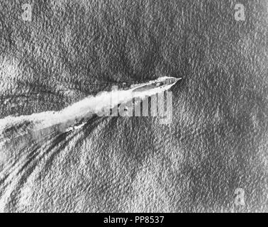 Battle of the Santa Cruz Islands, October 1942 - Japanese heavy cruiser Chikuma underway during the battle, as seen from a USS Enterprise (CV-6) aircraft, 26 October 1942. Note smoke coming from her bridge area, which had been hit by a bomb. Stock Photo