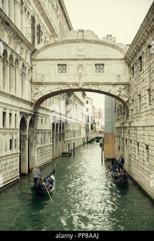 The Bridge of Sighs is a bridge located in Venice, northern Italy. The enclosed bridge is made of white limestone, has windows with stone bars, passes Stock Photo