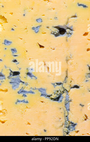 Yellow cheese with blue mold slice macro Stock Photo
