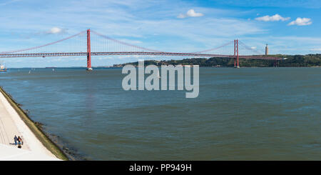 25 April Bridge, former Salazar bridge, over the Tagus river and Cristo Rei monument, Lisbon, Portugal Stock Photo