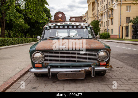 Old car with a roof rack in the city Stock Photo