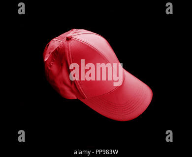 Red baseball cap on black background. Template for placing your design. Stock Photo