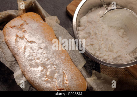 Easter pound cake with powdered sugar in baking mold with empty space for text Stock Photo