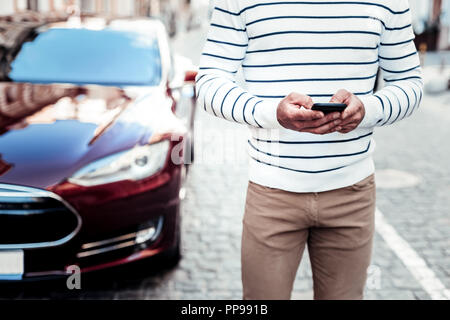 Close up of male hands that holding gadget Stock Photo
