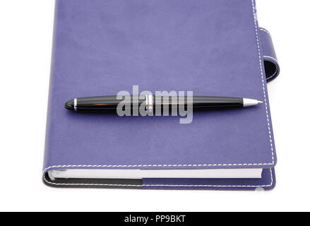 ballpoint pen is laying on the notebook Stock Photo
