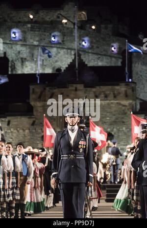 Capt. Riley Platt, United States Air Force Honor Guard Drill Team commander, stands at the position of attention during the Royal Edinburgh Military Tattoo on the Esplanade of the Edinburgh Castle, in Edinburgh, Scotland, Aug. 15, 2018. 48 countries performed alongside the drill team, with an audience of 220,000 viewers, and a televised viewer base of 100 million worldwide.  The Tattoo is a global gathering of differing talents and performers from every corner of the globe, allowing each participating country to display pride in their military power and culture. Stock Photo