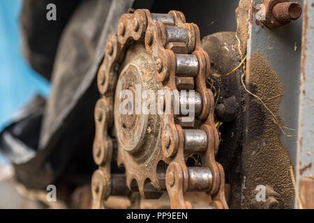 extreme close up of old rusty chain on cogwheel Stock Photo