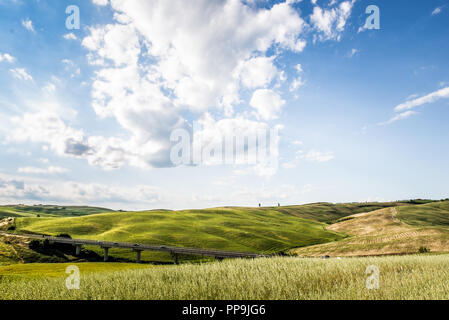 Scenic Tuscany landscape with rolling hills and beautiful cloudscape in Val d'Orcia Italy Stock Photo