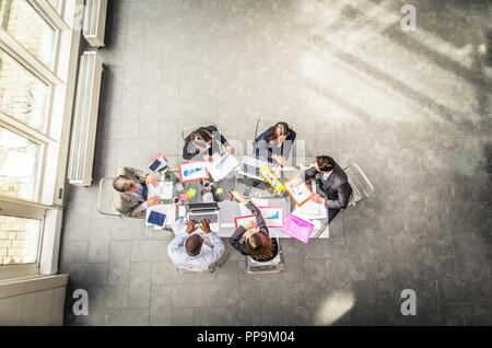Successful business team in a meeting conference room, concepts about teamwork and business - Team brainstorming in a modern start up office Stock Photo